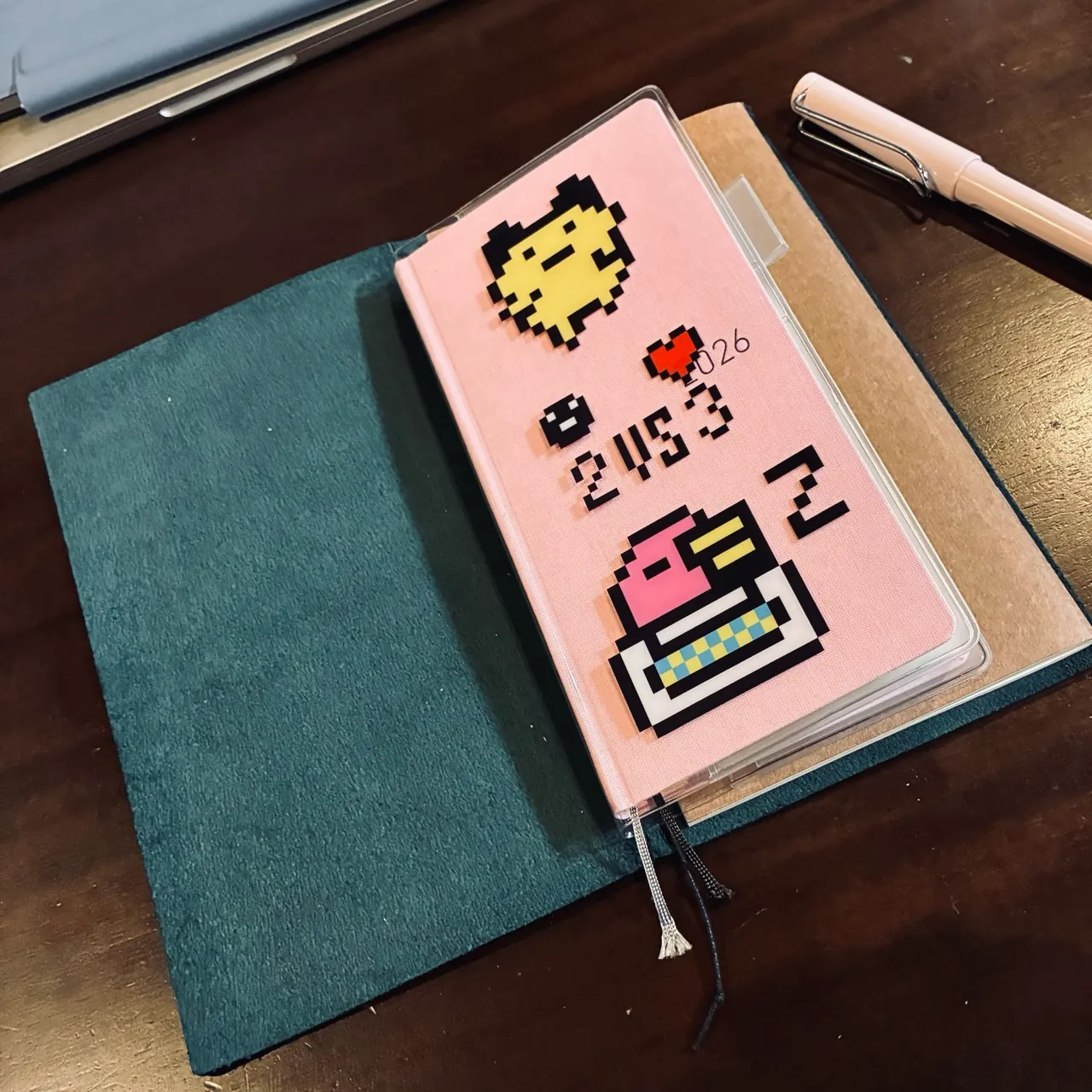 A Tamagotchi cover on the notebook